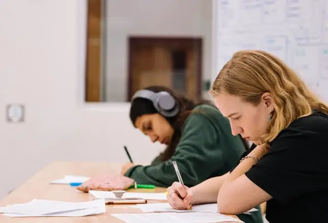 Two students preparing for finals in a classroom