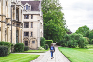 Student walking across a college campus