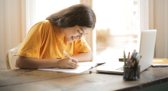 A girl completing her homework