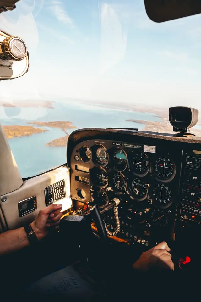 A pilot fulfilling their pilot requirements by completing flight hours on a plane