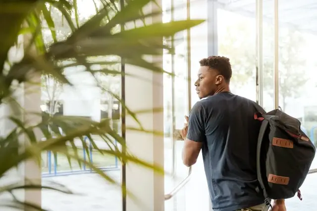 Student walking out of a building