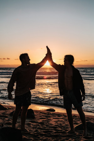 A student high-fiving his cosigner