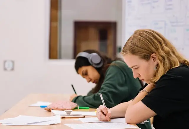 Students writing in their notebooks