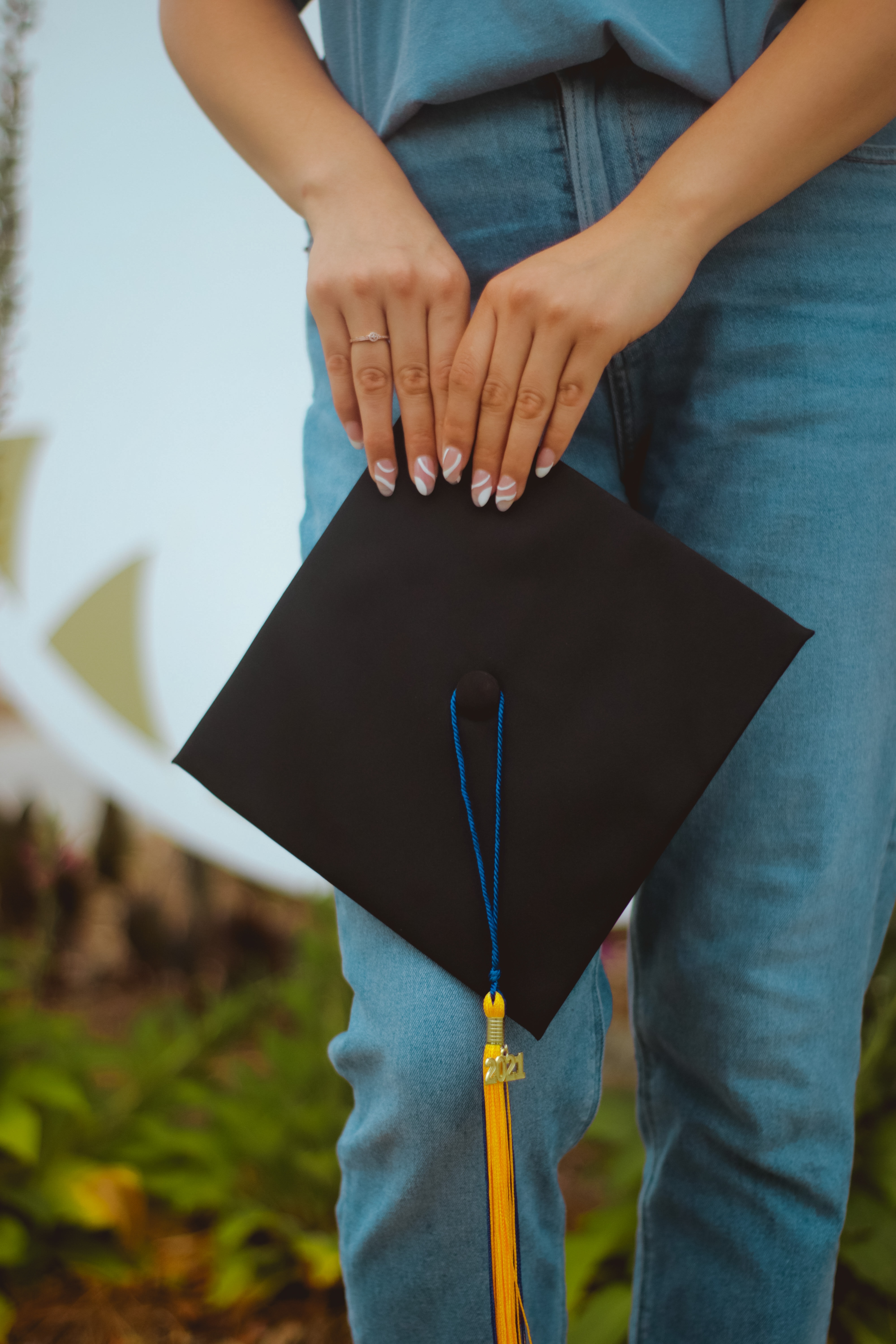 Girl standing with graduation cap
